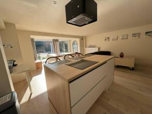 a kitchen with a island with a counter top at Modern Flat With Garden in Ostend