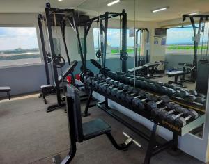 a gym with lots of equipment in a room at La grande Hotel & Residence in Angeles
