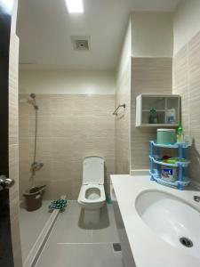 a small bathroom with a toilet and a sink at 8C Studio Unit with Free Wifi Pool and Gym in Mandaue City