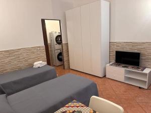a bedroom with a bed and a fireplace in it at Il rifugio Comoda e accogliente Casetta in Augusta