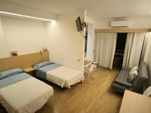 Ein Bett oder Betten in einem Zimmer der Unterkunft Relax and Beach