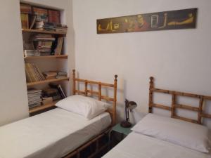 Posteľ alebo postele v izbe v ubytovaní maison vue sur la mer casamore