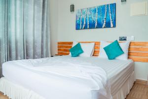 Voodi või voodid majutusasutuse IRIS Beach Residence toas