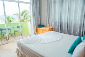 Voodi või voodid majutusasutuse IRIS Beach Residence toas