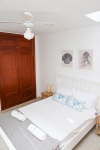 Łóżko lub łóżka w pokoju w obiekcie Casitas Tenerife - El Risco 2