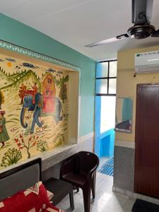 a room with a wall with a mural of an elephant at MOON NIGHT GUEST HOUSE in Jodhpur +73 photos
