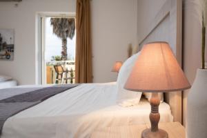Postel nebo postele na pokoji v ubytování Abelia Boutique Rooms