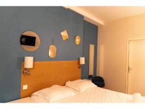 Giường trong phòng chung tại Le Clocher de Rodez Centre Gare