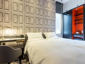 Voodi või voodid majutusasutuse Tango Inn Taipei Jihe toas