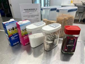 a counter with some food ingredients on a table at Wallaby Backpackers Hostel Perth - note - Valid passport required to check in - in Perth