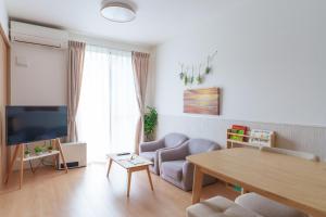 Un televizor și/sau centru de divertisment la Habitacion Cottage Suzu