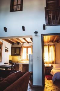 a room with a kitchen and a living room at Diminio 3 Whole House - Chalet in Arachova