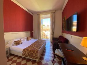 Postel nebo postele na pokoji v ubytování Basilica Hotel