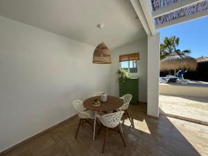 a dining room with a table and chairs at Casa Mediterráneo in Mazarrón