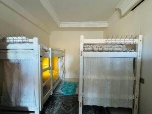 a room with two bunk beds in a room at Bolod Guesthouse and Tours in Ulaanbaatar +2 photos
