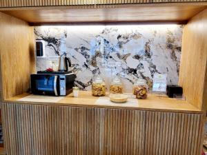 Kuchyň nebo kuchyňský kout v ubytování De Cozé Hotel