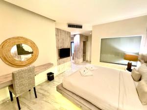 TV a/nebo společenská místnost v ubytování De Cozé Hotel