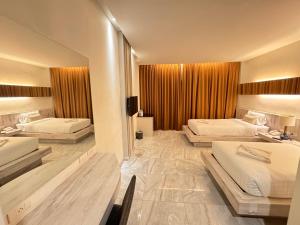 Postel nebo postele na pokoji v ubytování De Cozé Hotel