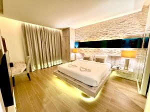 Postel nebo postele na pokoji v ubytování De Cozé Hotel
