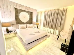 Postel nebo postele na pokoji v ubytování De Cozé Hotel