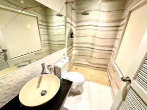 Koupelna v ubytování De Cozé Hotel
