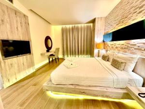 Postel nebo postele na pokoji v ubytování De Cozé Hotel