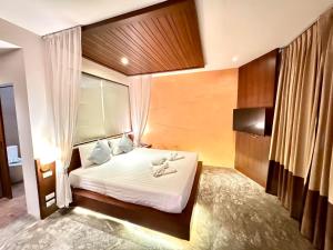 Postel nebo postele na pokoji v ubytování De Cozé Hotel