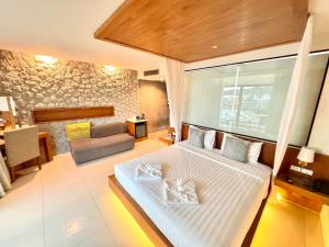 Postel nebo postele na pokoji v ubytování De Cozé Hotel