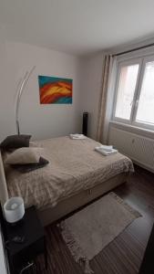 Postel nebo postele na pokoji v ubytování Stella Apartment