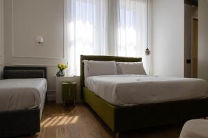 Postel nebo postele na pokoji v ubytování Bed and Breakfast SirenaResina