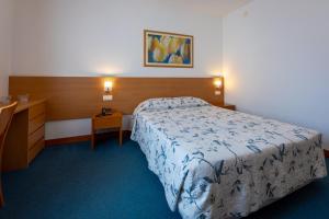 Postel nebo postele na pokoji v ubytování Hotel Matriz