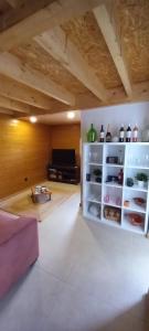 a living room with an open refrigerator with food at Casa da Igreja-Abadim in Cabeceiras de Basto
