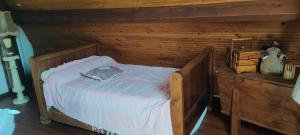 a wooden bed in a room with a wooden wall at Bed and breakfast in Mantes-la-Ville +9 photos