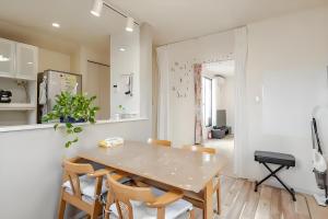 a kitchen and dining room with a table and chairs at MiShe主题南行徳民宿 in Tokyo