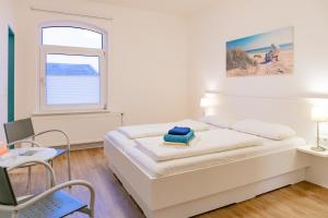 Postel nebo postele na pokoji v ubytování Haus Loccum + 4 fotografie