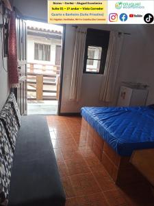 a bedroom with a blue bed in a room at Búzios – Geribá – Suítes - Aluguel Econômico in Búzios +275 photos
