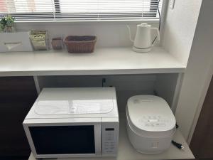 Mynd úr myndasafni af 站前1分钟 近镰仓 江之岛等景点 全新一户建 直达东京新宿 江之岛 可住7人 带天台 í Fujisawa