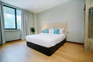 Postel nebo postele na pokoji v ubytování Kingston Hotel 8 - Kuala Lumpur Bukit Bintang