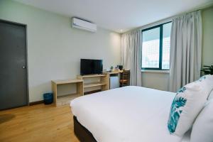 TV a/nebo společenská místnost v ubytování Kingston Hotel 8 - Kuala Lumpur Bukit Bintang