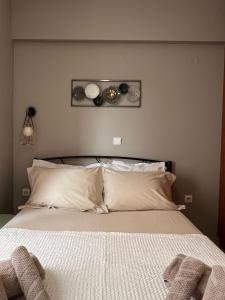 Postel nebo postele na pokoji v ubytování Αγρίνιο κέντρο ΔΣ A2 + 9 fotografií