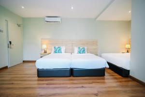Postel nebo postele na pokoji v ubytování Kingston Hotel 8 - Kuala Lumpur Bukit Bintang