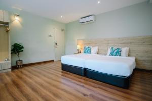 Postel nebo postele na pokoji v ubytování Kingston Hotel 8 - Kuala Lumpur Bukit Bintang