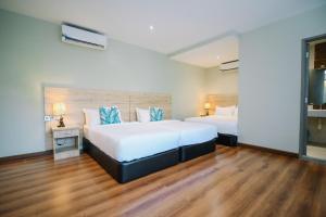Postel nebo postele na pokoji v ubytování Kingston Hotel 8 - Kuala Lumpur Bukit Bintang