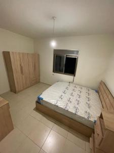 Giường trong phòng chung tại The Majestic Garden Escape