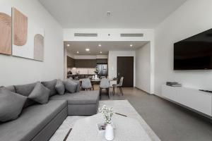 a living room with a couch and a table at Prime Burj Khalifa&Fountain Views 2 Bdr Apartment in Dubai +66 photos