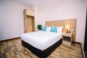 Postel nebo postele na pokoji v ubytování Kingston Hotel 8 - Kuala Lumpur Bukit Bintang