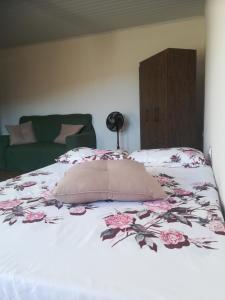 En eller flere senge i et værelse på Chalet Vida de Roça