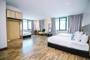 Postel nebo postele na pokoji v ubytování Kingston Hotel 8 - Kuala Lumpur Bukit Bintang