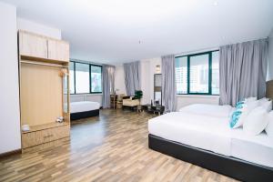 Postel nebo postele na pokoji v ubytování Kingston Hotel 8 - Kuala Lumpur Bukit Bintang + 37 fotografií