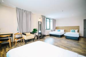 Postel nebo postele na pokoji v ubytování Kingston Hotel 8 - Kuala Lumpur Bukit Bintang